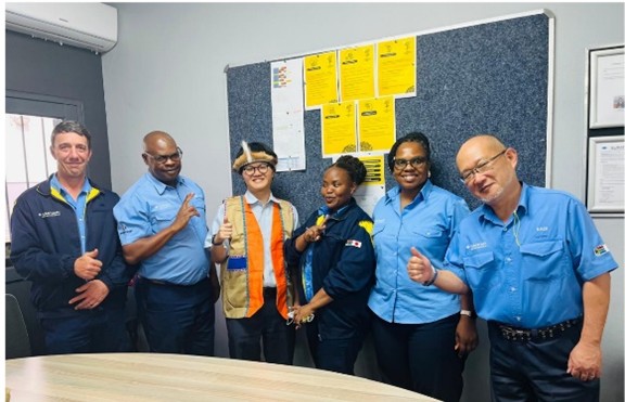 Interacting with local staff (the dispatched employee is the third person from the left)