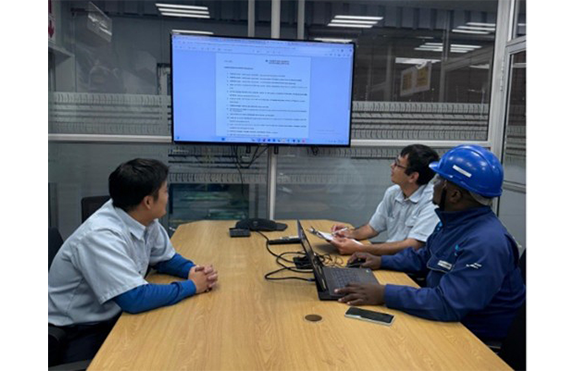 Regular curing maintenance meeting with local staff (front right)
