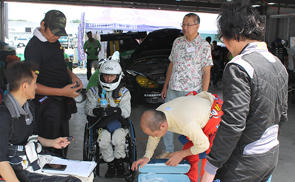 Participants in the “Dream Maker Racing Project” preparing for racing (photo taken in 2019)