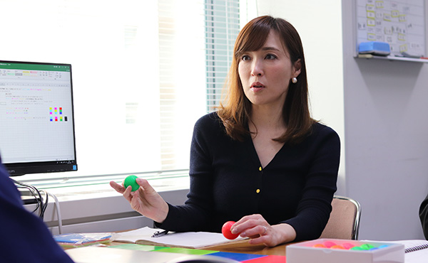 An employee now able to take part in a product development meeting by leveraging time freed up by the introduction of RPA